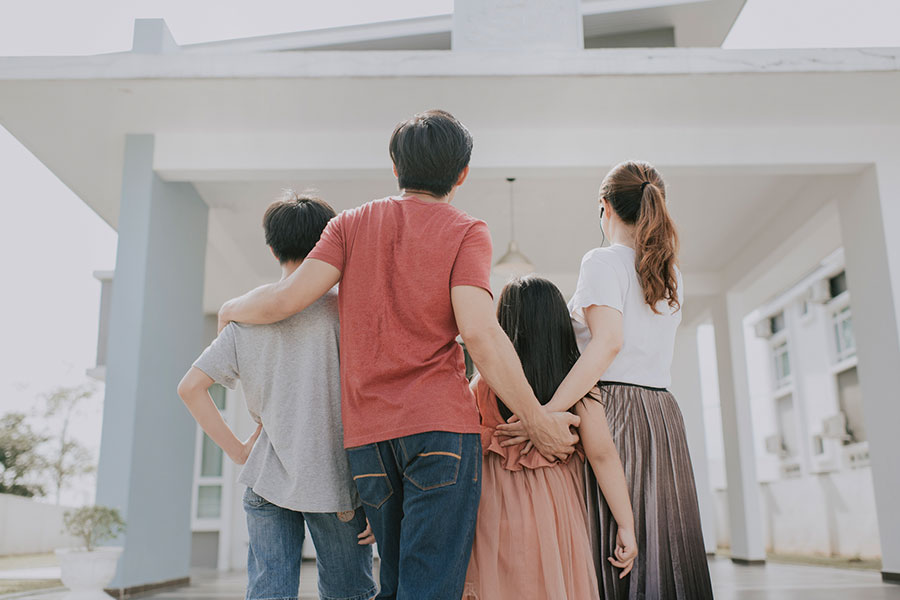 A family standing in front of their Chicago automated house